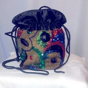 ROBINSONS Vintage multi colored sequined black pouch bag.